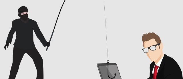 man doet phishing bij man achter computer